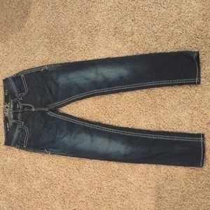Buckle black skinny jeans.